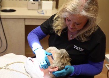 Dr. Shults performing oral cancer screening