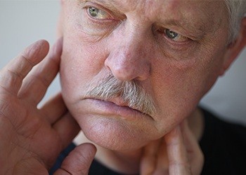 Older man holding jaw joints
