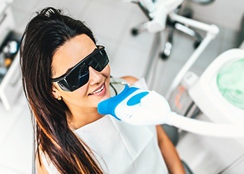 Woman receiving in-office teeth whitening