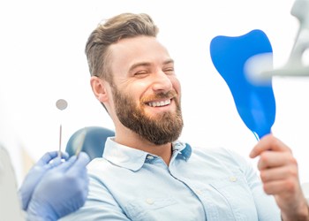 Man smiling in mirror