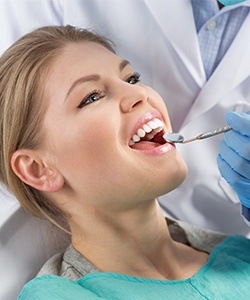 Woman receiving dental exam