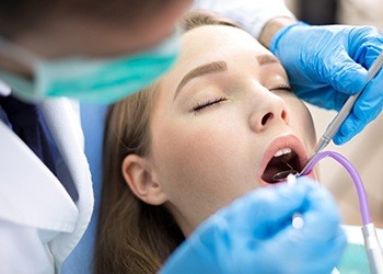 Woman receiving fluoride treatment