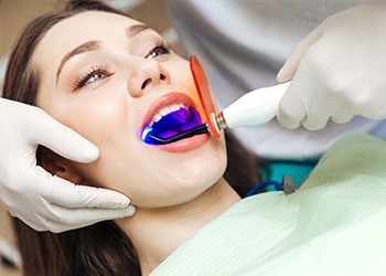 Woman receiving dental treatment