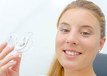 Young woman holding sportsguard